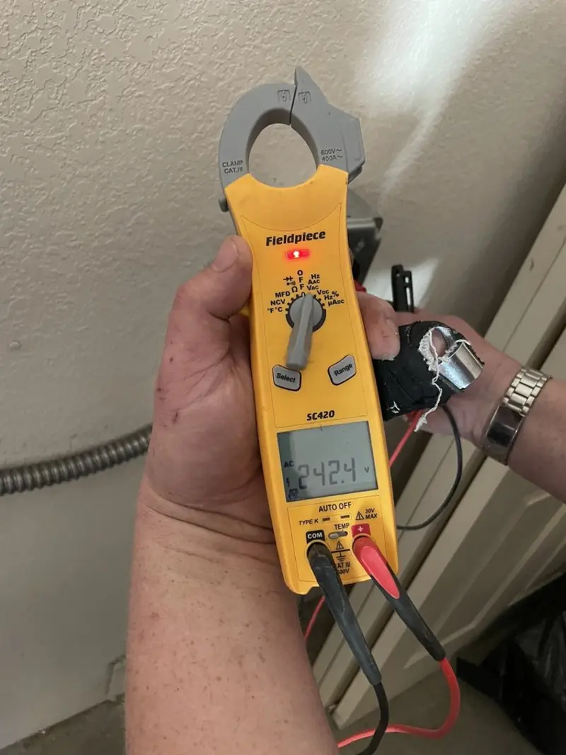 Voltage testing with clamp meter during Recessed Lighting Installation in Ada